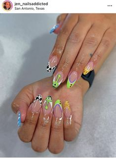 Toy Story Almond Nails, Cute Toy Story Nails, Universal Themed Nails, Disney Themed Nails Acrylic Almond, Disney Almond Nails Designs, Toy Story Alien Nails, Universal Nail Designs, Buzz Light Year Nails, Pixar Nails Acrylic