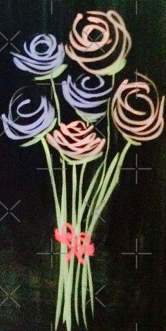 some flowers are on a black background with pink and blue swirls in the center