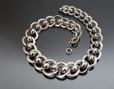 "Iconic Bauhaus style necklace. 1930's, Idar-Oberstein, Germany, Jakob Bengel. (Identify: Das Industriedenkmal Jakob Bengel, Idar-Oberstein). MADE OF: metal chrome plated, brass possibly. CONDITION: Excellent vintage condition - no loses of plate, dents or repairs. Spring ring clasp works fine. MEASUREMENTS: Length from end to end: 15 3/4\" (39,7cm). Width: 5/8\" - 1\" (15 - 24mm). Weight: 72,4g * * * All our items are packed in gift boxes, easy to check of content and re-pack. If you wish somet Chain Art, Christmas Bling, Bauhaus Style, Style Necklace, Chrome Plating, Spring Rings, Gift Boxes, Chains Necklace, Fashion Rings