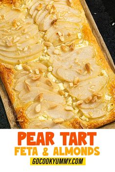 an image of pear tart with almonds on the top and below it in a baking pan