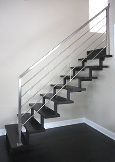 a black and white photo of a stair case