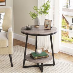 a living room with a chair, table and pictures on the wall next to it