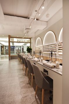 a row of chairs sitting next to each other in front of a counter