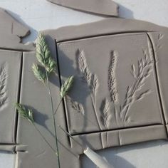 two pieces of clay that have been made to look like plants