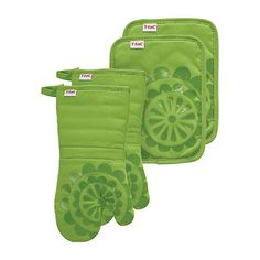 three green oven mitts are shown with labels on the front and back of them