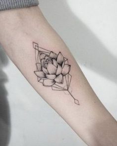 a black and white photo of a flower on the left arm, with geometric shapes in the background