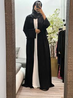 Elevate your modest wardrobe with our collection of open abayas. With a belt to cinch the waistline, this abaya is perfect for those who prefer a more fitted look. Available in four different colors, this versatile piece can be worn for any casual occasion. Season: All Seasons Stretch: None Occasion: Casual The long flare sleeves add a touch of elegance to the overall design and provide ample coverage. This open abaya is perfect for layering over your favorite outfits while still maintaining modesty. Incorporate this stylish piece into your everyday wardrobe and effortlessly enhance your Muslim fashion attire. Elevate your modest wardrobe with our collection of open abayas. With a belt to cinch the waistline, this abaya is perfect for those who prefer a more fitted look. Available in four Open Abayas, White Abaya, Abaya Outfit, Modest Wardrobe, Black Abaya, Open Abaya, Flare Sleeves, Hijab Fashion Inspiration, Fashion Attire