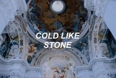 the words cold like stone are in front of an ornate ceiling with paintings on it