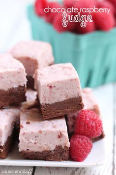 chocolate raspberry fudge brownies on a plate with raspberries