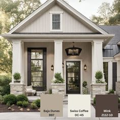 the exterior of a house with white trim and black shutters