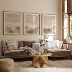 a living room filled with furniture and paintings on the wall above it's coffee table