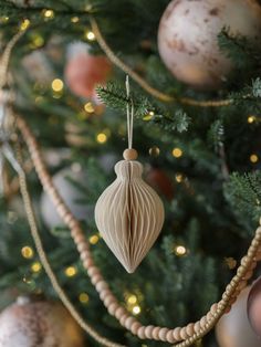 a christmas tree with ornaments hanging from it