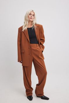 These suit pants feature a waistband with belt loops and a zipper, hook and button closure. They have a pleat detail on the front and 2 front pockets. These suit pants feature 2 mock back pockets and wide, straight legs. Inseam length in size 36: 80 cm / 31.49 in. Madewell Pant Suit, Suits Straight Pants, Cognac Effortless Pant, Straight Leg Pant Suit Women, Women’s Suit Pants Wide Leg, Rust Long Pants, Suits For Women Straight Leg, Rust Pants Women, Womens Suits Wide Leg