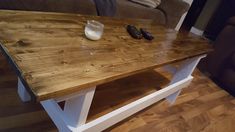 a wooden table sitting on top of a hard wood floor