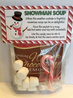 a package of marshmallows in the shape of a snowman and a candy cane