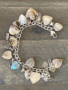 Vintage Sterling Silver LOVE Charm Bracelet w/ 24 RARE Charms 7". Heart Lock Clasp SilverCharms on bracelet: 16 Decorative hearts -one is engraved “mother” -one says “Forget Me Not” -one is blank and could be engraved Ice Skate Wine Chalice Praying Angel Girl in Dress “Love” Stamp Flower Basket Angel Bell Decorative Hearts, Chunky Charm Bracelet, Sterling Silver Charm Necklace, Charm Bracelet Silver, Praying Angel, Spoon Bracelet, Vintage Sterling Silver Charms, Vintage Charm Bracelet, Heart Lock