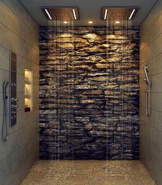 a bathroom with a stone wall and shower