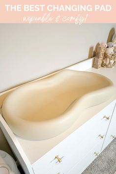 a bathroom sink with the words, the best changing pad wipeable and comfort on it