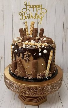 a birthday cake with chocolate frosting and marshmallows