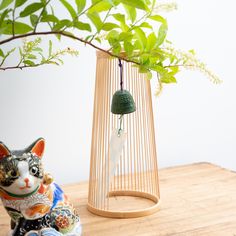 This wind bell is a combination of Suruga Bamboo Basketry and Nambu Ironware, a traditional craft of Iwate Prefecture in the Tohoku region.The wind bell is hung from the top of the bamboo craft with metal fittings.By using bamboo strips around the wind bell, a refreshingly cool interior is achieved.Hanging wind chimes are good, but in a room, a wind bell placed on the tables is also convenient. When placed in a breezeway or blown by an air conditioner or fan, the beautiful and cool tone of the ironware, which is different from that of glass, is soothing and comfortable.The wind bell can be easily removed, so it makes a wonderful interior decoration for hanging mascots or accessories in seasons other than summer.Please note that this product is lightweight, so it may topple over if the wind Cool Interior, Wind Bell, Bamboo Crafts, Traditional Crafts, Cool Tones, Interior Decoration, Air Conditioner, The Wind, Wind Chimes