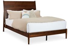 a bed with white sheets and pillows on it's headboard, against a white background