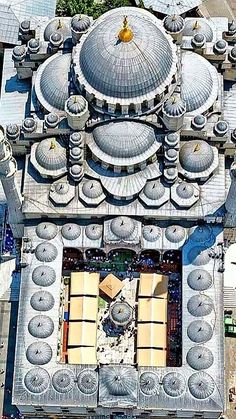 an aerial view of a large building with many domes on it's roof and windows