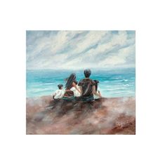 two people sitting on the beach looking out at the ocean