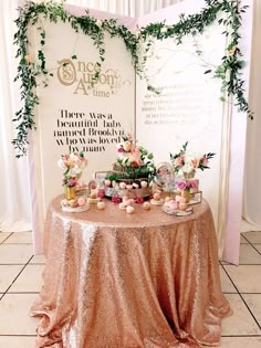 a table topped with lots of desserts next to a sign that says once upon at time