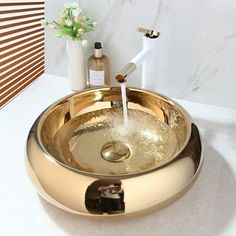 a bathroom sink with a faucet and soap dispenser