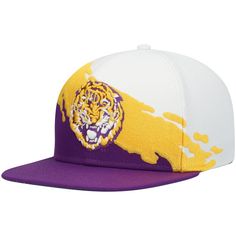 a purple and white hat with a yellow tiger on it's front, sitting against a white background