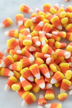 there are many candy corn on the table