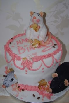 there is a cake decorated with mice on it