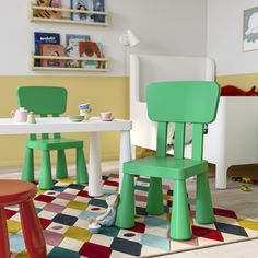 two children's chairs and table in a playroom