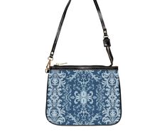 This unique and vibrant shoulder bag adds a chic touch to any outfit. Its compact size (10"w x 8"h) and lightweight construction makes it the perfect accessory for carrying around your essentials in style. Our one of a kind purse features an archival fabric design in baroque flourishes of sapphire, sky and pale blues. This gorgeous design is printed onto high-grade vegan leather and shipped to you by our top-rated production partner. We also offer the coordinating vegan wallet: https://thecheekyshedonist.etsy.com/listing/1680599038 .: 100% high-grade vegan leather exterior .: Polyester lining + 20-inch black strap .: Two open pockets inside .: Gold-toned zipper and hardware .: Original + unique art history design exclusively available at The Cheeky Shedonist  Care instructions: avoid prolo Trendy Shoulder Bag With Zipper Pouch, Blue Mobile Phone Evening Bag, Blue Clutch Shoulder Bag, Trendy Shoulder Bag Pouch With Detachable Handle, Blue Handheld Pouch For Daily Use, Blue Pouch Shoulder Bag With Detachable Strap, Blue Satchel Clutch With Removable Pouch, Blue Clutch Bag With Detachable Strap, Blue Clutch Shoulder Bag For Travel