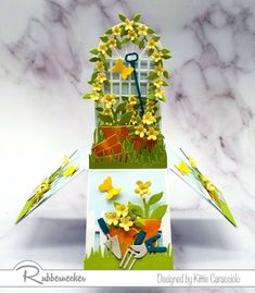 an image of a card with flowers and gardening tools in it on top of a table