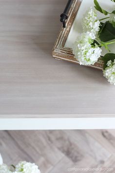 some white flowers are sitting on a table