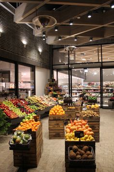 the produce section of a grocery store filled with lots of fresh fruits and veggies