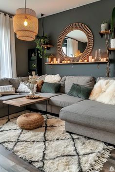 a living room filled with lots of furniture next to a large mirror on the wall