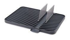 an image of a grill grate with several forks in it on a white background