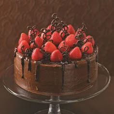 a chocolate cake with strawberries on top