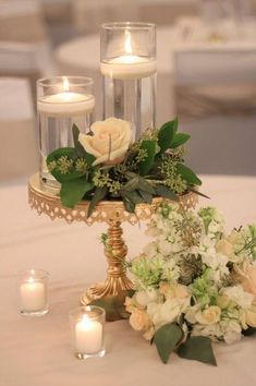 the centerpiece is adorned with flowers and candles