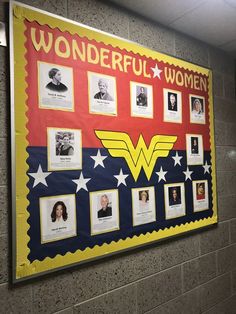 a bulletin board with pictures of women and men in the center, on a wall