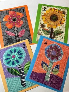 four cards with different designs on them and numbers in the middle one has a sunflower