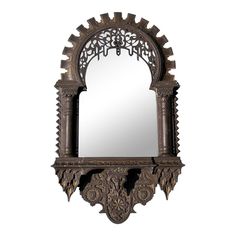 an ornate mirror hanging on the wall