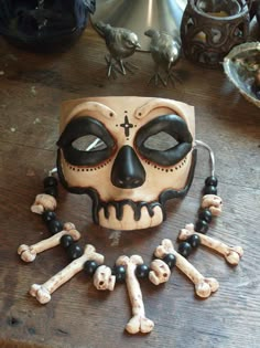 a skull and cross bones mask on a table