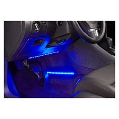 the interior of a car with blue lights