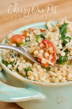 a blue bowl filled with rice and vegetables