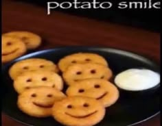 there is a plate full of cookies with smiley faces on it