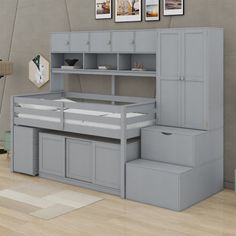 there is a loft bed with stairs to the top and bottom drawers on each side