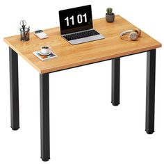 a laptop computer sitting on top of a wooden desk